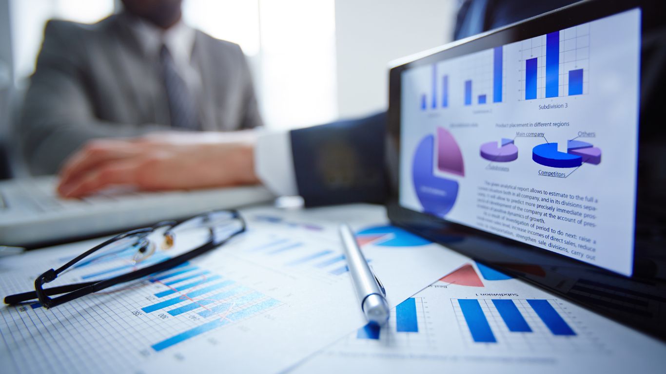 The Benefits of Partnering with a Marketing Agency for Maximum Impact Professional setting showing a person working on marketing data, emphasizing the value of partnering with a marketing agency.